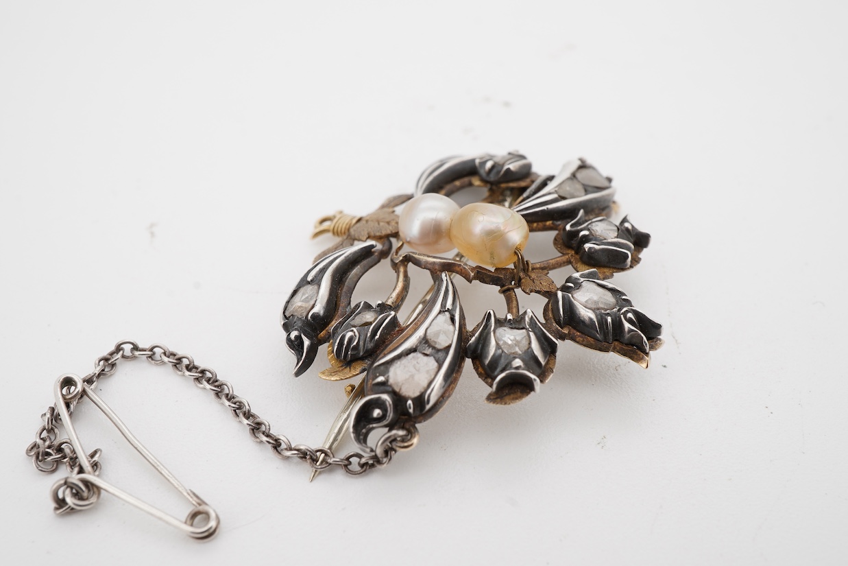 A yellow and white metal, pearl and rose cut diamond set bouquet brooch, width 36mm, pearls untested, with an associated Edward Tessier gilt tooled red leather fitted box.